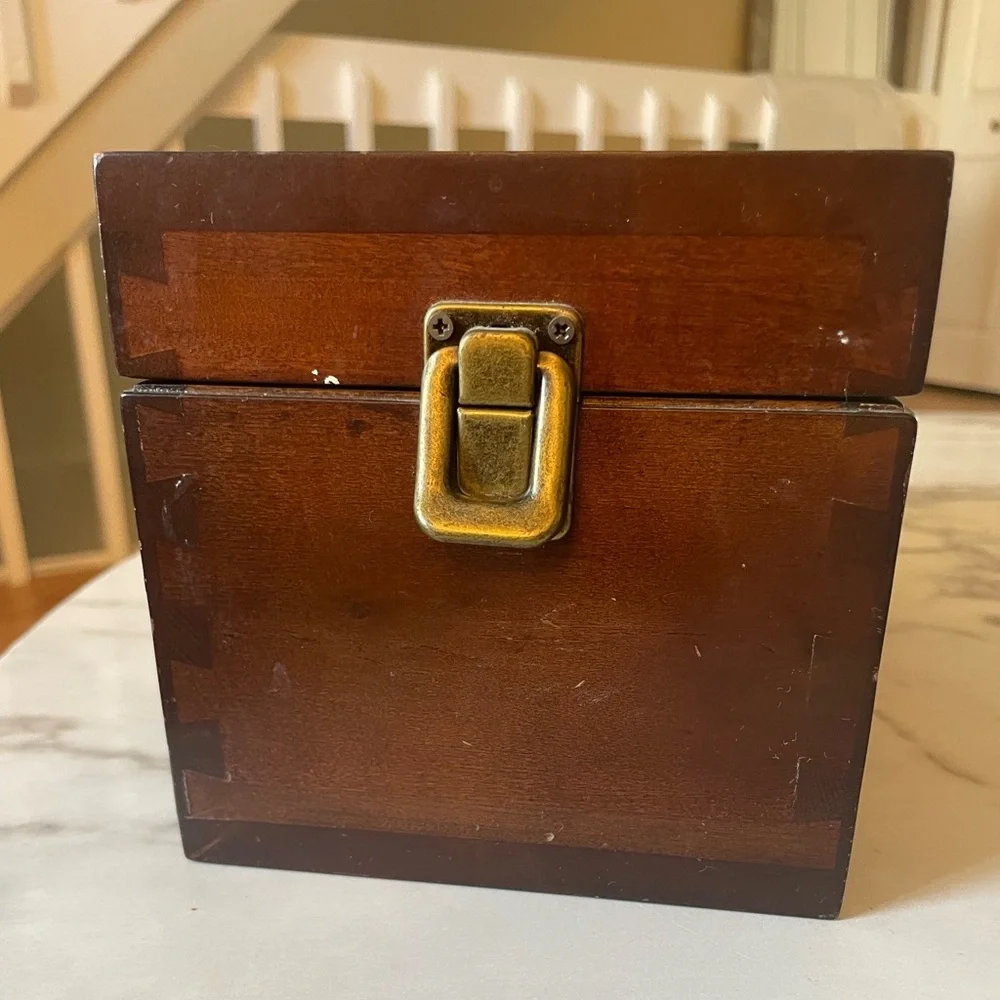 Wooden box for displaying coins with the name marked Danze logo